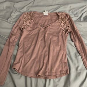 Tan long sleeve shirt with lace on the shoulders